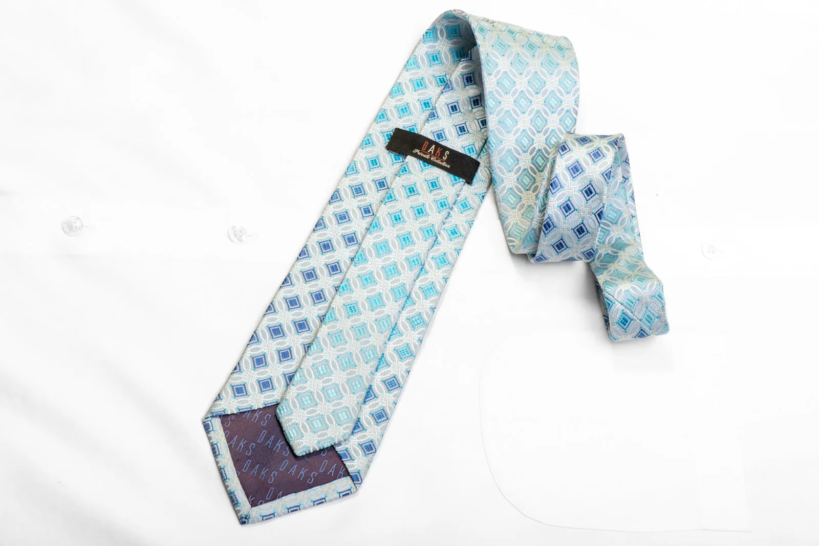 Silver Interlocking Circles On Pale Blue With Blue Sparkles