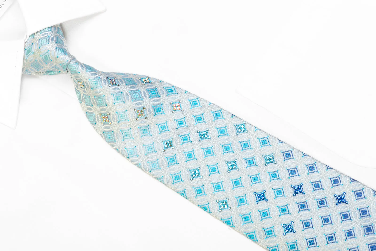 Silver Interlocking Circles On Pale Blue With Blue Sparkles