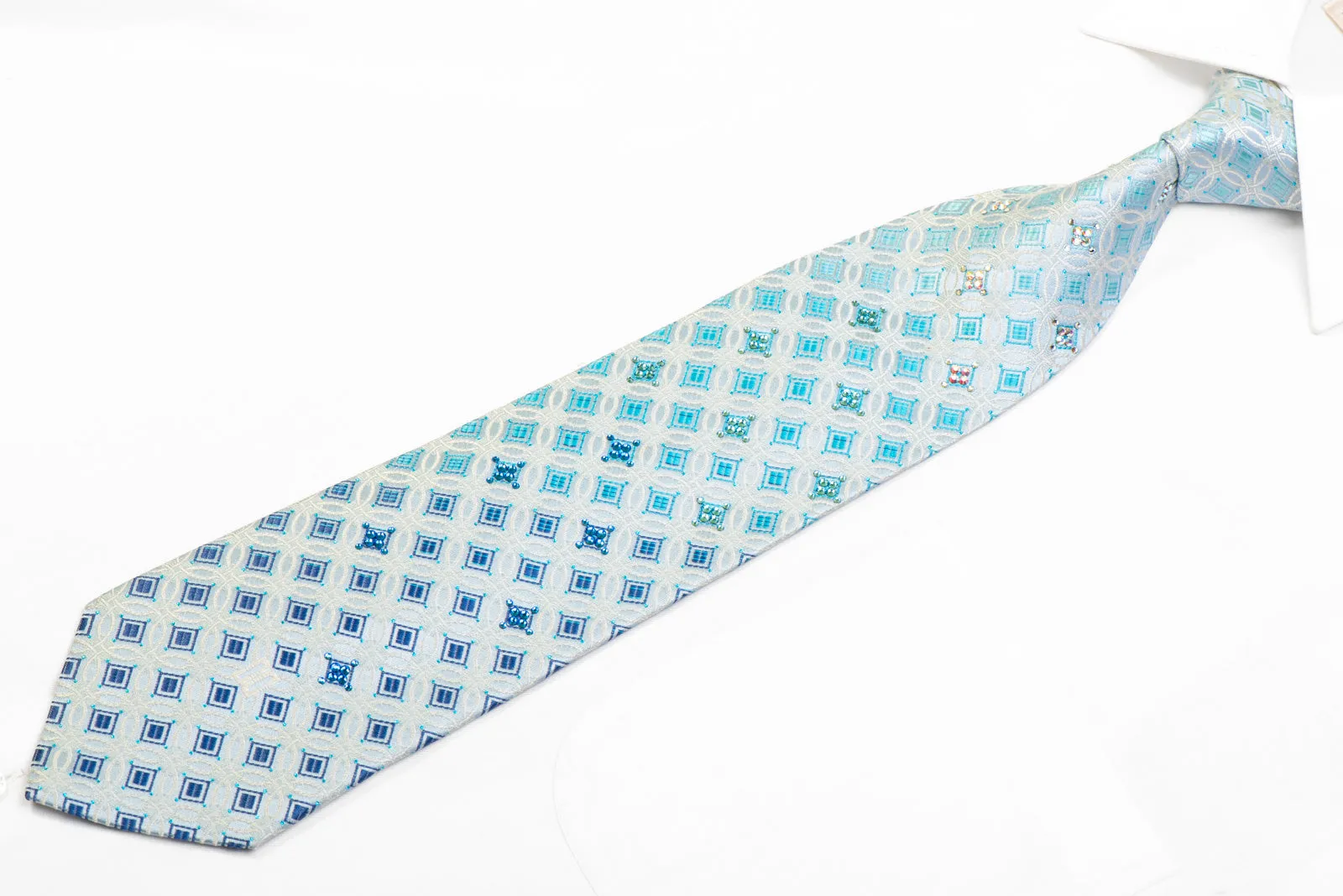 Silver Interlocking Circles On Pale Blue With Blue Sparkles